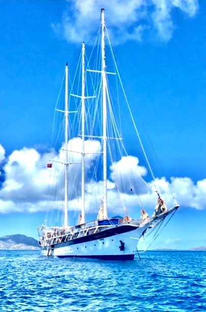White sailing yacht on calm blue sea