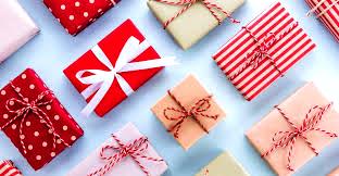 Assorted wrapped gift boxes with bows