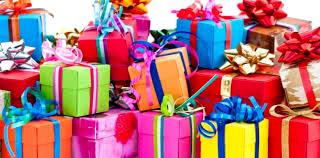 Colorful wrapped gift boxes with ribbons and bows