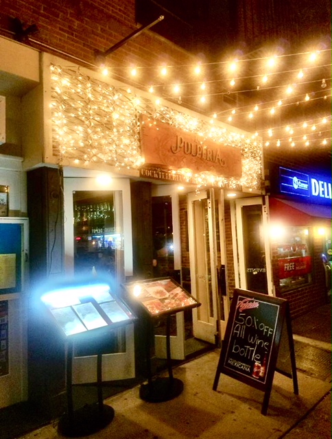 Cozy restaurant entrance with string lights