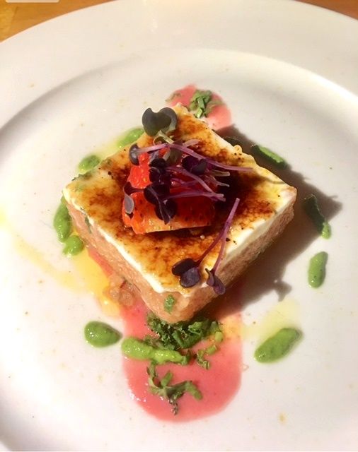 Bruleed cheese toast with salmon and microgreens