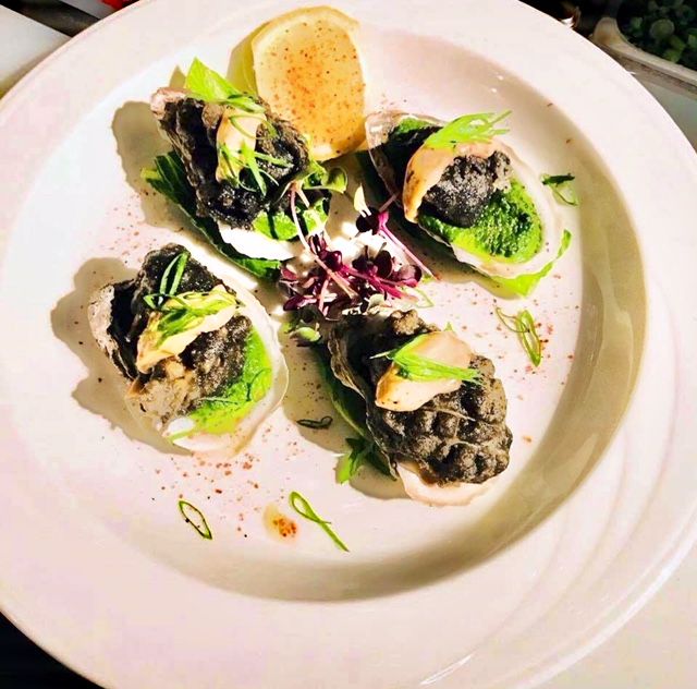 Oysters on half shell with green sauce