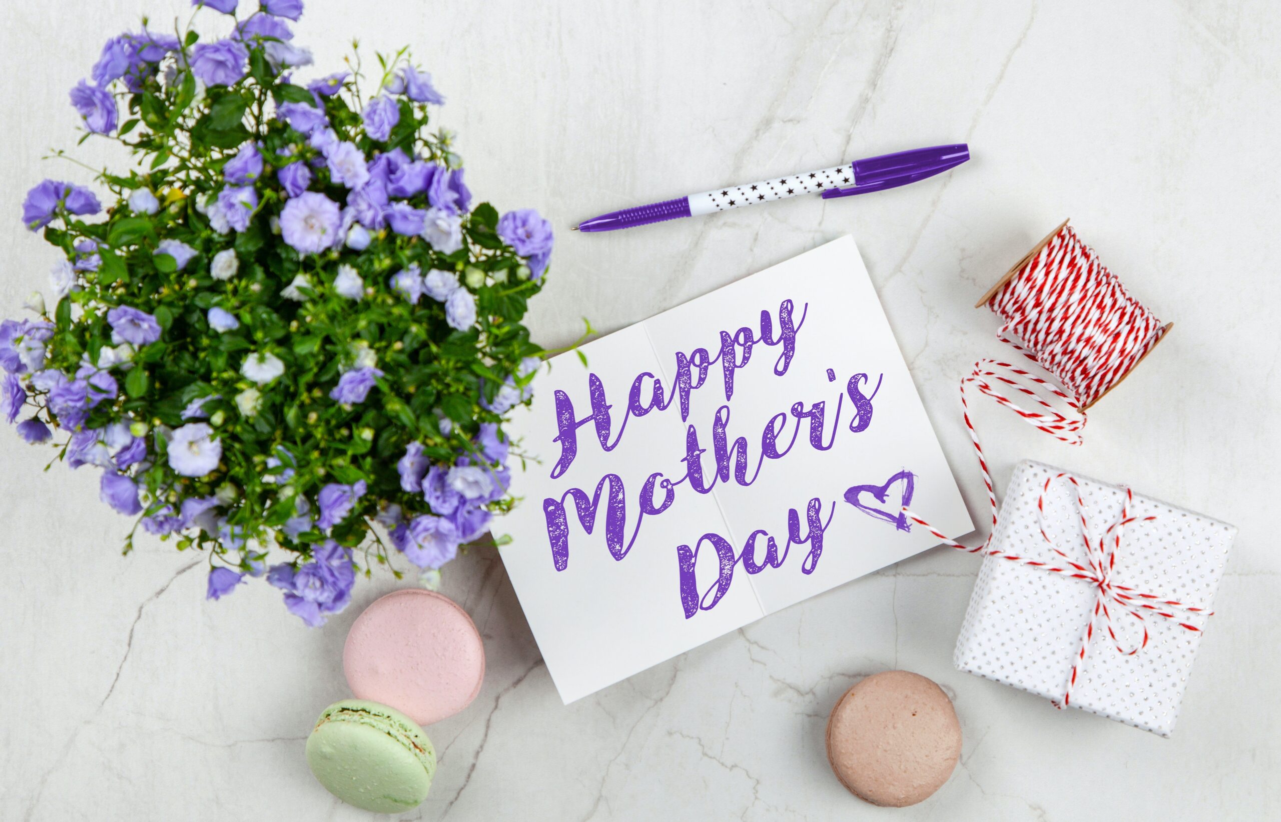 Mother's Day card with purple flowers and gifts