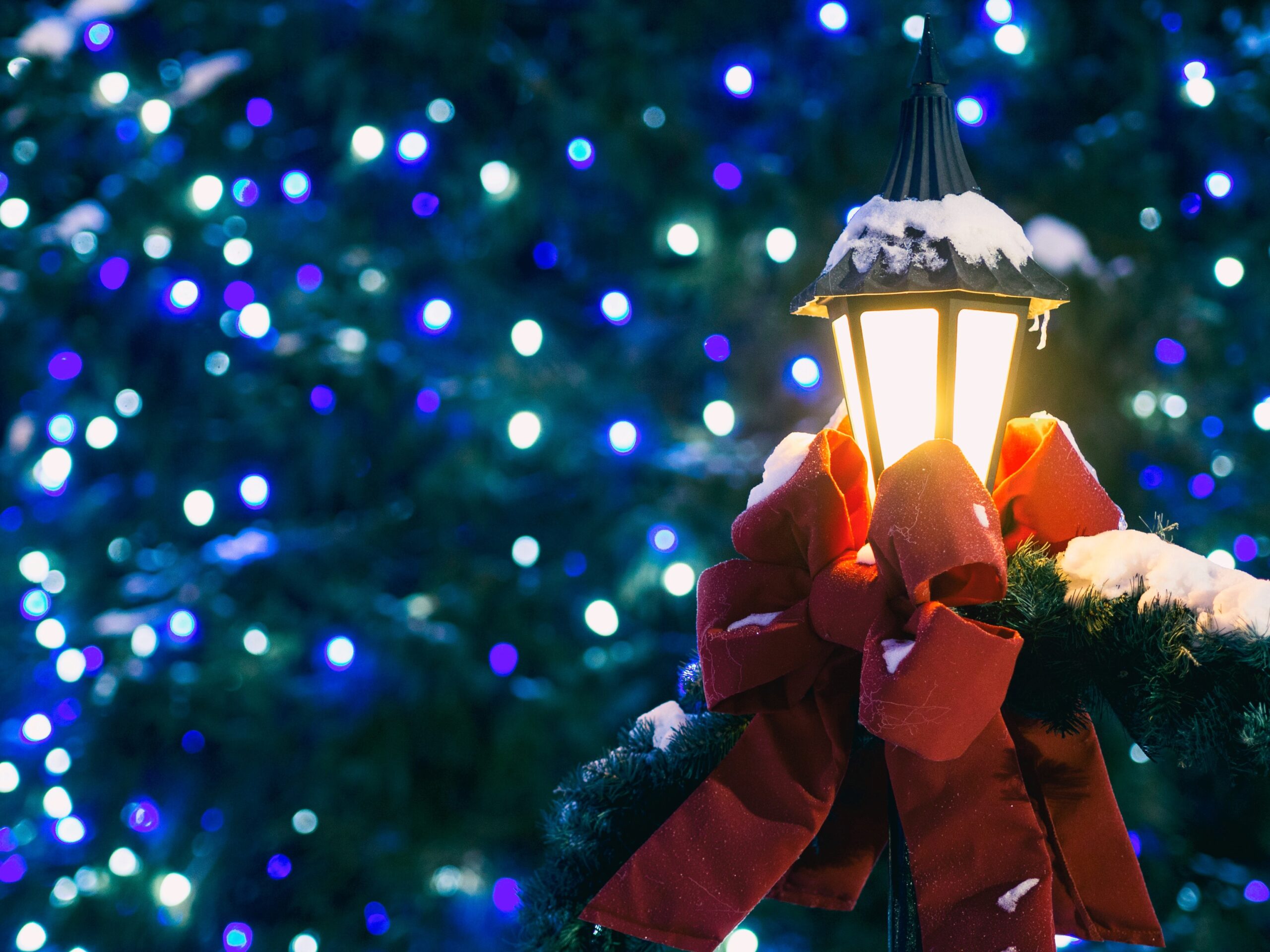 Christmas lamppost with red bow and lights