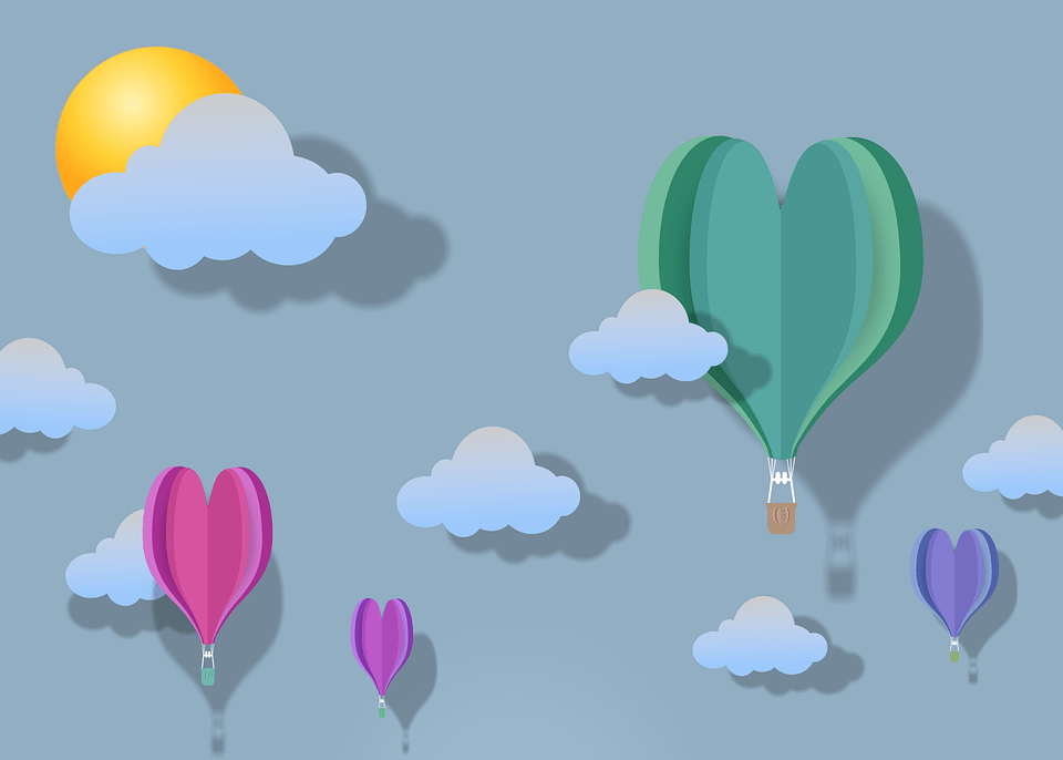 Pastel heart-shaped hot air balloons above clouds