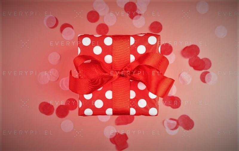 Red polka dot gift with ribbon bow