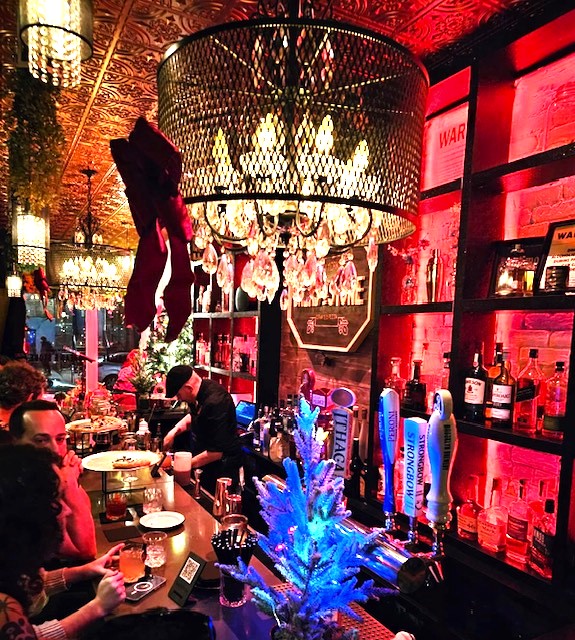 Festive dimly lit bar with chandelier