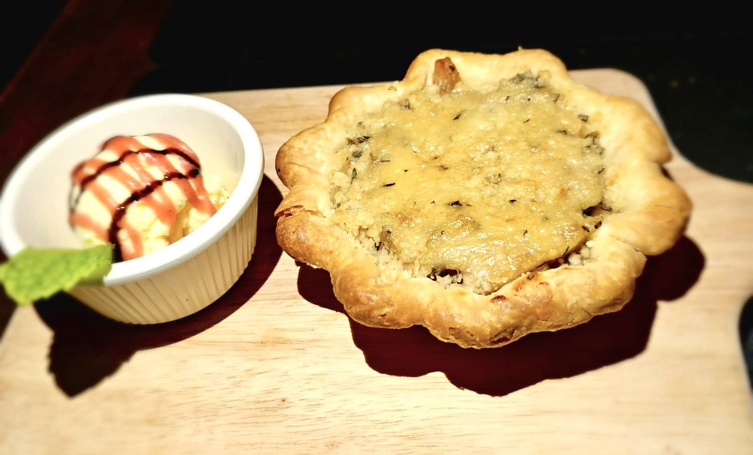 Baked cheese tart with ice cream and mint