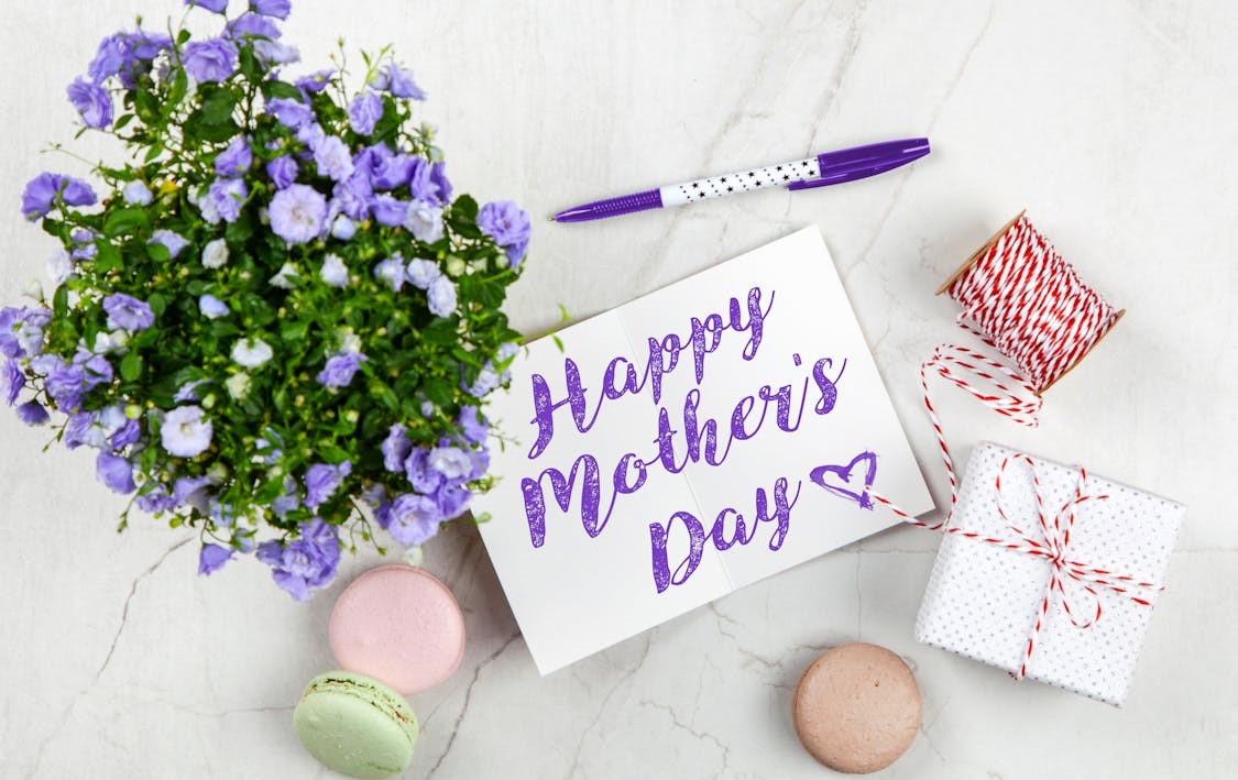 Happy Mother's Day card with flowers and gifts