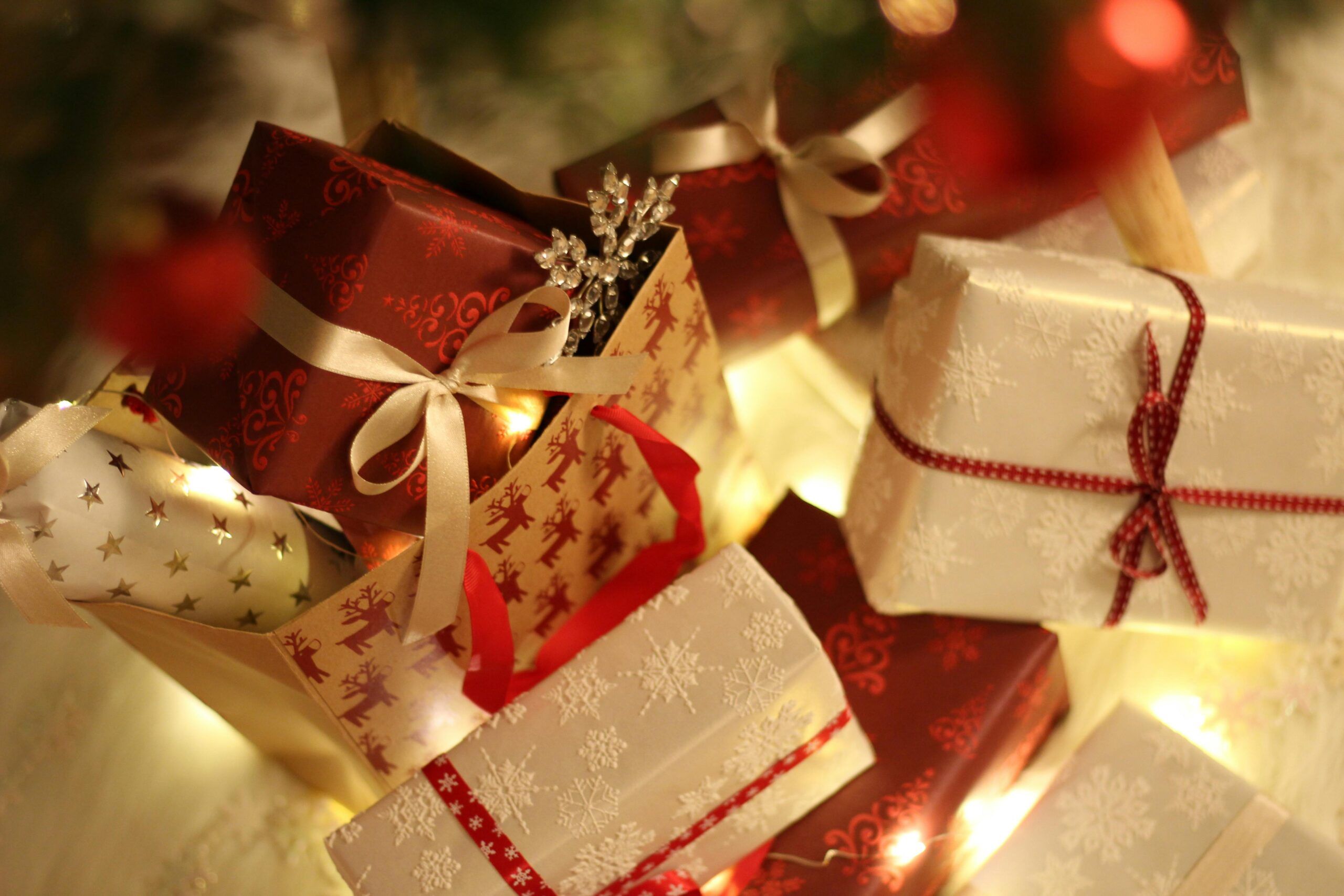 Stack of wrapped Christmas presents with ribbons