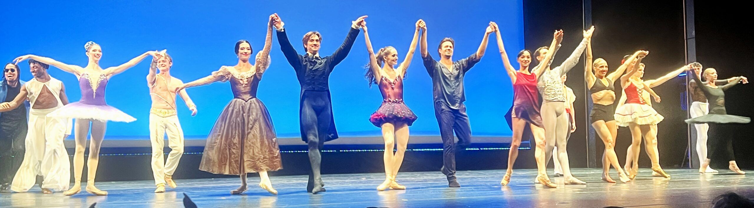 Ballet dancers holding hands during curtain call