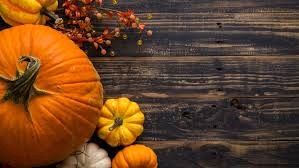 Autumn pumpkins and gourds on wooden table
