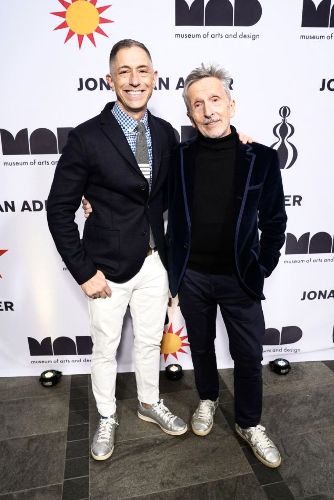 Two men smiling at museum event