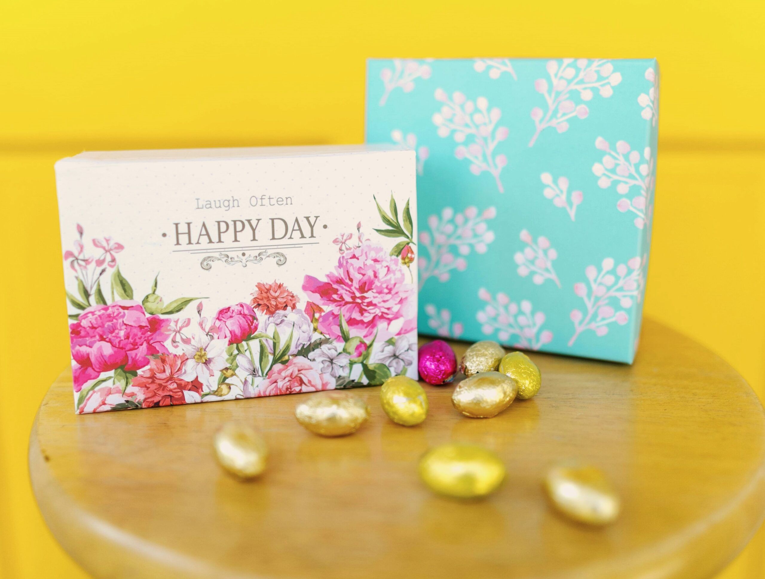 Floral gift boxes with foil-wrapped chocolates