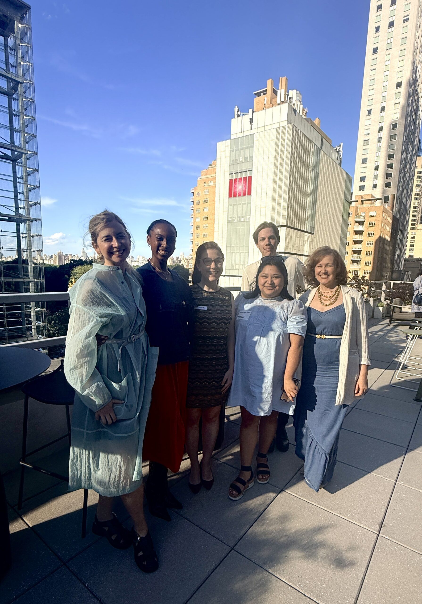 Group of six women on city rooftop