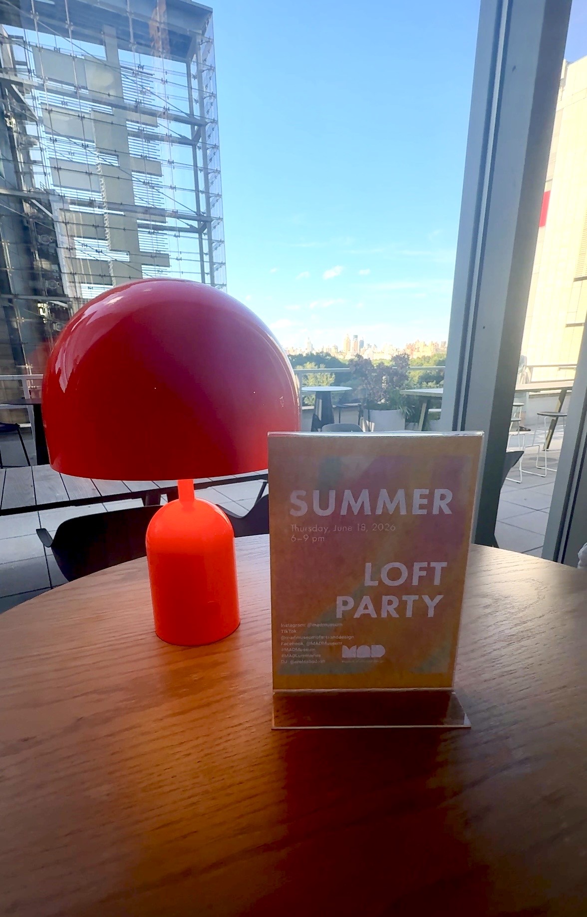 Red lamp beside Summer Loft Party sign