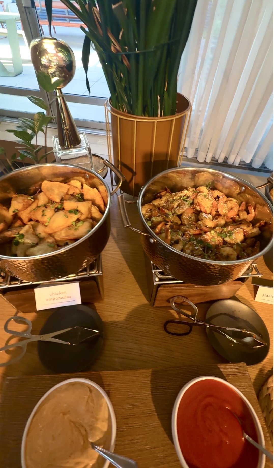 Buffet table with two hot chafing dishes