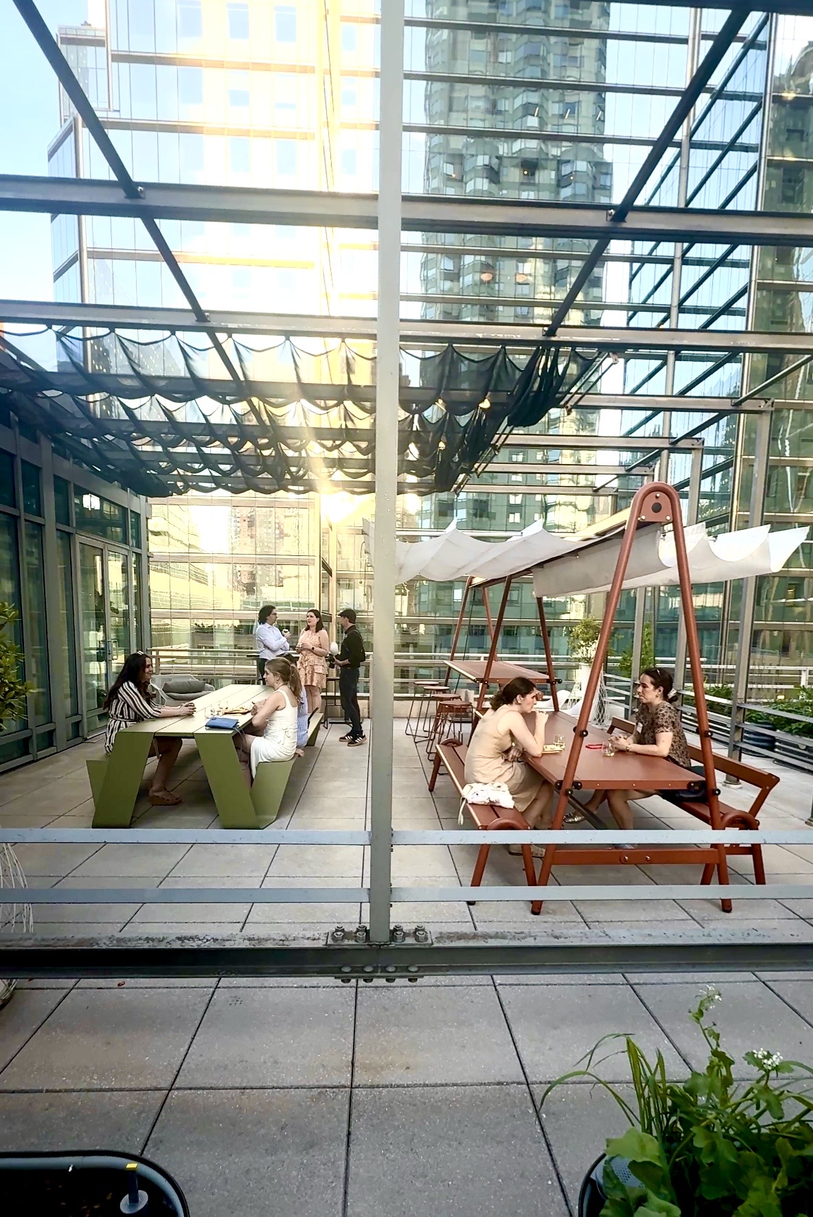 Urban rooftop patio with dining swings